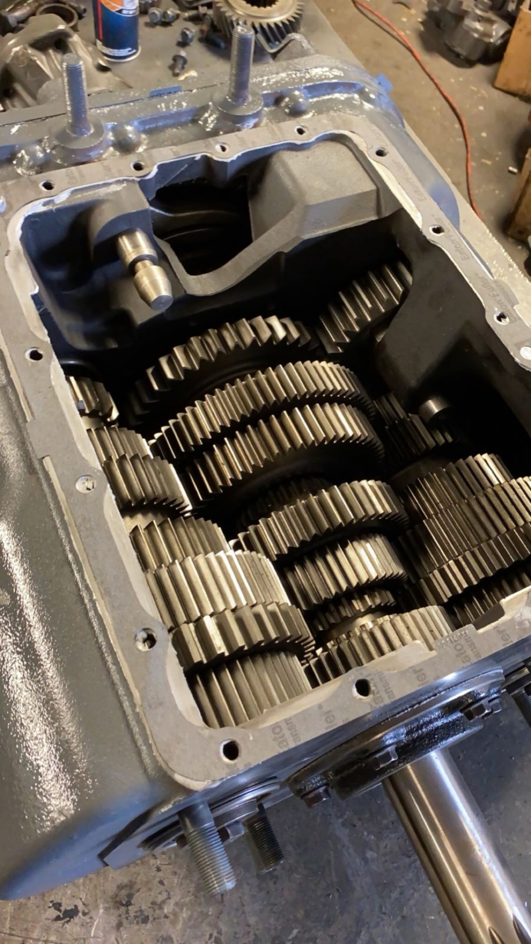 Internal view of truck transmission gears during professional rebuild service